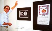 Director Danny Butts, posing with the poster and dishtowel.