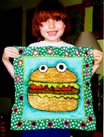 Benjamin Stern models the Hamburger cake. Andi Stern 1998.