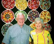 George and Donna Leigh Jackins pose with her quilt at QN.