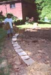 Jimmy starts to create the rows in the rainbow garden.