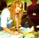 Janet Burke works on birthday card fabric in class. Photo Susan Shie 2000