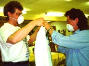 Pastor Paul and Jimmy, airbrushing robes.