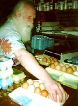 My brother, Jimmy Shie, grading eggs at the co-op.