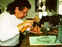 Jimmy, tooling the proof of the leather measuring cups. Susan Shie 1999.