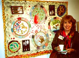 Jane Burch Cochran and her quilt at QN '01. ©Susan Shie 2001.
