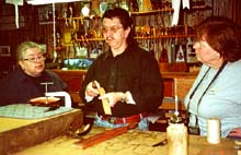 Jimmy shows the campers some leather techniques.Susan Shie 2001.