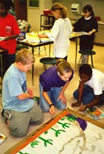 Students painting murals. ©Susan Shie 2001.