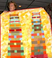 Joyce Seagram and her quilt about 9-11. ©Susan Shie 2002.