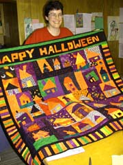 Tonya and her Halloween quilt.©Susan Shie 2002.