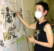 Susan airbrushing at Q/SDS. Susan Shie 2002.