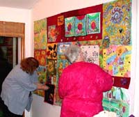 Sara and Carol Mac working on quilt. ©Susan Shie 2003.