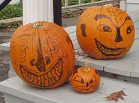 Gretchen, Mike, and Isis' pumpkins.©Gretchen Miller 2003.