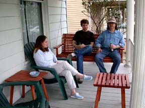 Gretchen, Mike, and Jimmy on the porch in Lakewood.©Susan Shie 2004.